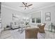 Comfortable living room featuring ample sunlight, a ceiling fan, and neutral tones at 1109 Wigeon Dr., Conway, SC 29526