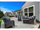 Spacious outdoor patio area featuring cozy seating, grill, and a view of the hot tub at 1118 Prescott Circle, Myrtle Beach, SC 29577