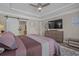 Spacious main bedroom with a ceiling fan, decorative rug, and adjoining bathroom at 1118 Prescott Circle, Myrtle Beach, SC 29577