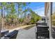 Back patio with outdoor seating and mature landscaping at 1118 Prescott Circle, Myrtle Beach, SC 29577