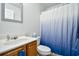 Simple bathroom with a wood vanity and a blue ombré shower curtain at 1144 Harvest Circle # 1144, Myrtle Beach, SC 29579