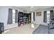 Bedroom with large windows, a ceiling fan, a gray futon, and shelving at 1144 Harvest Circle # 1144, Myrtle Beach, SC 29579