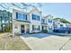 Inviting townhome exterior features a well-kept lawn and a convenient driveway and tasteful landscaping at 1144 Harvest Circle # 1144, Myrtle Beach, SC 29579