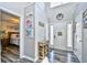 Bright and airy foyer featuring tall ceilings, a stylish table, and a view into the bedroom at 1144 Harvest Circle # 1144, Myrtle Beach, SC 29579