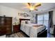 Bedroom with light walls, ceiling fan, window, and dark furniture at 1144 Harvest Circle # 1144, Myrtle Beach, SC 29579