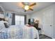 Bedroom with ceiling fan, dark wood furniture, and a window with curtains at 1144 Harvest Circle # 1144, Myrtle Beach, SC 29579