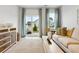 Bright living room with sliding glass doors and a neutral color palette at 1146 Blueback Herring Way # 147, Conway, SC 29526