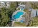 Aerial shot showcases a large outdoor community pool with lounge chairs, cabana, and pristine surroundings at 136 Da Gullah Way # B, Pawleys Island, SC 29585