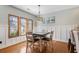 Cozy dining room with modern lighting and seating for four at 136 Da Gullah Way # B, Pawleys Island, SC 29585