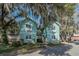 Two-story residential building with blue siding, featuring multiple windows and a shared staircase at 136 Da Gullah Way # B, Pawleys Island, SC 29585