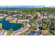 Aerial view of the townhome community, featuring a pond and trees. Downtown buildings in the background at 1450 Portrait Circle # 1450, Myrtle Beach, SC 29577