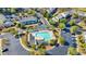 Aerial view of the community pool in the neighborhood with ample parking and palm trees surrounding it at 1450 Portrait Circle # 1450, Myrtle Beach, SC 29577