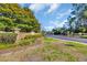 Community entrance with brick signage, professional landscaping, and a secure gated entry at 1450 Portrait Circle # 1450, Myrtle Beach, SC 29577