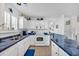 White cabinets with blue countertops and stainless steel appliances enhance this kitchen at 1450 Portrait Circle # 1450, Myrtle Beach, SC 29577