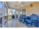 Inviting screened porch with blue furniture, ceiling fan, and access to the backyard at 1450 Portrait Circle # 1450, Myrtle Beach, SC 29577