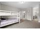 Spacious bedroom with white bunk beds and neutral carpeting at 149 Ella Kinley Circle # 405, Myrtle Beach, SC 29588