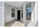 Covered entryway with a black front door, sidelight windows, and a 'hello' welcome mat at 1541 Palmina Loop # C, Myrtle Beach, SC 29588