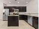 Modern kitchen with stainless steel appliances, an island, granite countertops, and dark wood cabinets at 1541 Palmina Loop # C, Myrtle Beach, SC 29588