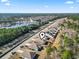 A panoramic view showcasing houses in a community by the water with lush green surroundings at 156 Legends Village Loop, Myrtle Beach, SC 29579