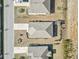Aerial view of homes showcasing roof lines, driveways, and manicured landscaping at 156 Legends Village Loop, Myrtle Beach, SC 29579