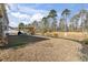 A spacious backyard features manicured landscaping and a pergola area, perfect for outdoor activities and gatherings at 156 Legends Village Loop, Myrtle Beach, SC 29579