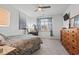 Bright bedroom featuring a bed, desk, and a wooden dresser, creating a relaxing and functional space at 156 Legends Village Loop, Myrtle Beach, SC 29579