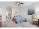 Comfortable bedroom featuring soft carpeting, ceiling fan, and ocean-themed decor at 156 Legends Village Loop, Myrtle Beach, SC 29579
