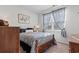 Comfortable bedroom with blue bedding, coordinated decor, and natural light at 156 Legends Village Loop, Myrtle Beach, SC 29579