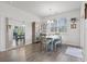 An inviting dining room is enhanced by natural light, a decorative mirror and stylish furnishings at 156 Legends Village Loop, Myrtle Beach, SC 29579