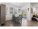Bright dining room with a rustic table set, view to the backyard and a door to the exterior at 156 Legends Village Loop, Myrtle Beach, SC 29579