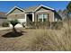 Charming brick home featuring a well-manicured lawn, a one car garage, and stylish shutters at 156 Legends Village Loop, Myrtle Beach, SC 29579