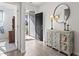 Bright foyer showcasing wood floors, a decorative mirror, a console table, and an open doorway at 156 Legends Village Loop, Myrtle Beach, SC 29579