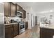 Well-equipped kitchen with stainless steel appliances, granite countertops, and ample cabinet space at 156 Legends Village Loop, Myrtle Beach, SC 29579