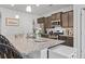 Stylish kitchen island with seating, granite countertops, and stainless steel sink at 156 Legends Village Loop, Myrtle Beach, SC 29579