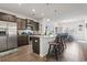 Modern kitchen with dark cabinets, stainless steel appliances, and a large granite island at 156 Legends Village Loop, Myrtle Beach, SC 29579