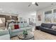 Bright living room featuring hardwood floors, a ceiling fan, and an open floor plan at 156 Legends Village Loop, Myrtle Beach, SC 29579