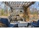 Inviting outdoor patio area with comfortable seating under a charming pergola at 156 Legends Village Loop, Myrtle Beach, SC 29579