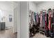 Walk-in closet providing ample storage space; bathroom visible in the background at 156 Legends Village Loop, Myrtle Beach, SC 29579