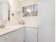 Bright bathroom with white cabinets, white countertop, sink, and mirror at 157 Egret Run Ln. # 522, Pawleys Island, SC 29585