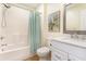 Well-lit bathroom with a shower-tub combo, a framed mirror, and a vanity with storage at 157 Egret Run Ln. # 522, Pawleys Island, SC 29585