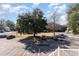 Community parking lot with parking spaces available under a large shade tree at 157 Egret Run Ln. # 522, Pawleys Island, SC 29585