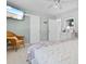 Cozy bedroom featuring soft lighting, a stylish wicker chair, and a beach-themed television display at 1607 Havens Dr., North Myrtle Beach, SC 29582