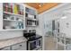 Kitchen featuring white cabinets, stainless steel appliances, and an opening to the dining area at 1607 Havens Dr., North Myrtle Beach, SC 29582