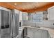 Bright kitchen with stainless steel appliances, marble counters, and wooden ceiling at 1607 Havens Dr., North Myrtle Beach, SC 29582