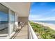 Private balcony offers sweeping ocean views, perfect for relaxing or entertaining guests on lounge chairs at 1625 S Ocean Blvd. # 403, North Myrtle Beach, SC 29582