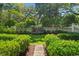 Serene backyard featuring a fountain, manicured hedges, and a well-maintained lawn at 201 Broad St., Georgetown, SC 29440