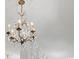 Ornate chandelier with crystal accents hangs from an elegant ceiling medallion at 201 Broad St., Georgetown, SC 29440