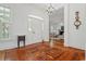 Spacious foyer featuring a chandelier and hardwood floors, offering an inviting entry into the home at 201 Broad St., Georgetown, SC 29440