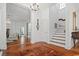 Elegant foyer with hardwood floors and a grand staircase, creating a welcoming entrance at 201 Broad St., Georgetown, SC 29440