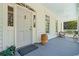 Charming front porch featuring neutral colors and comfortable seating, creating a welcoming outdoor space at 201 Broad St., Georgetown, SC 29440